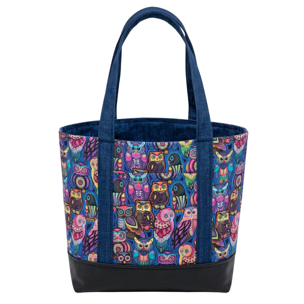 Handmade cotton tote bag with colorful owl pattern, navy handles, and structured black base