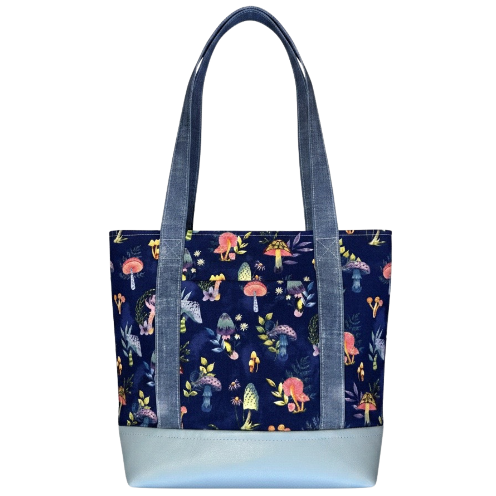 Handmade cotton tote bag featuring whimsical mushrooms on a navy background with chambray handles and powder blue faux leather base