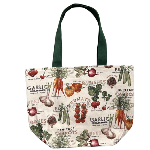 Handmade canvas tote bag featuring heirloom vegetables and vintage market illustrations with forest green handles.