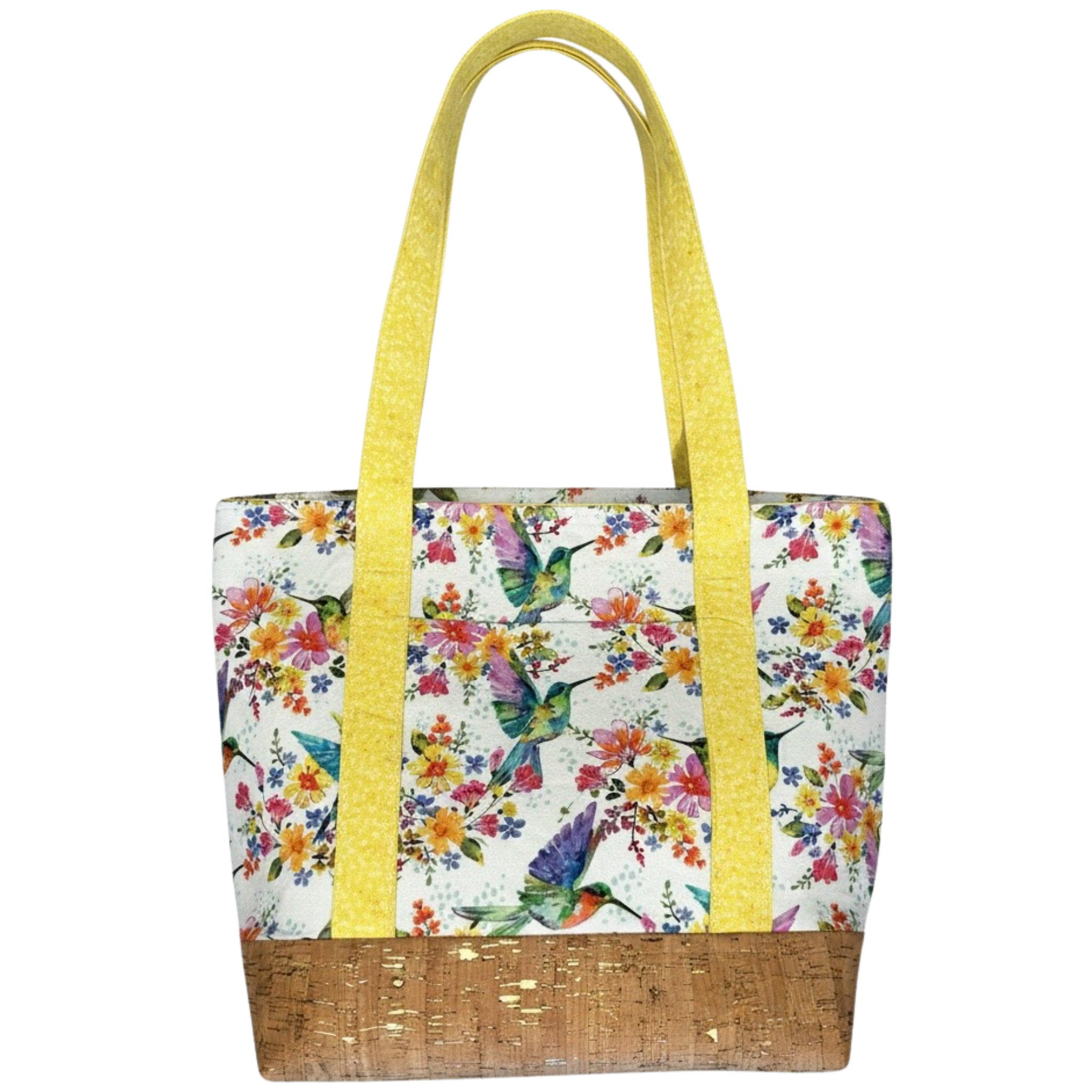 Handmade cotton tote bag featuring colorful hummingbirds and flowers with sunshine yellow handles and natural cork base