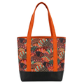 Handmade cotton tote bag with owl feather pattern in warm tones, burnt orange handles, and structured black base