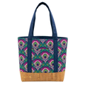 Handmade cotton tote bag with bold peacock eye pattern, navy straps, and cork base with gold flecks