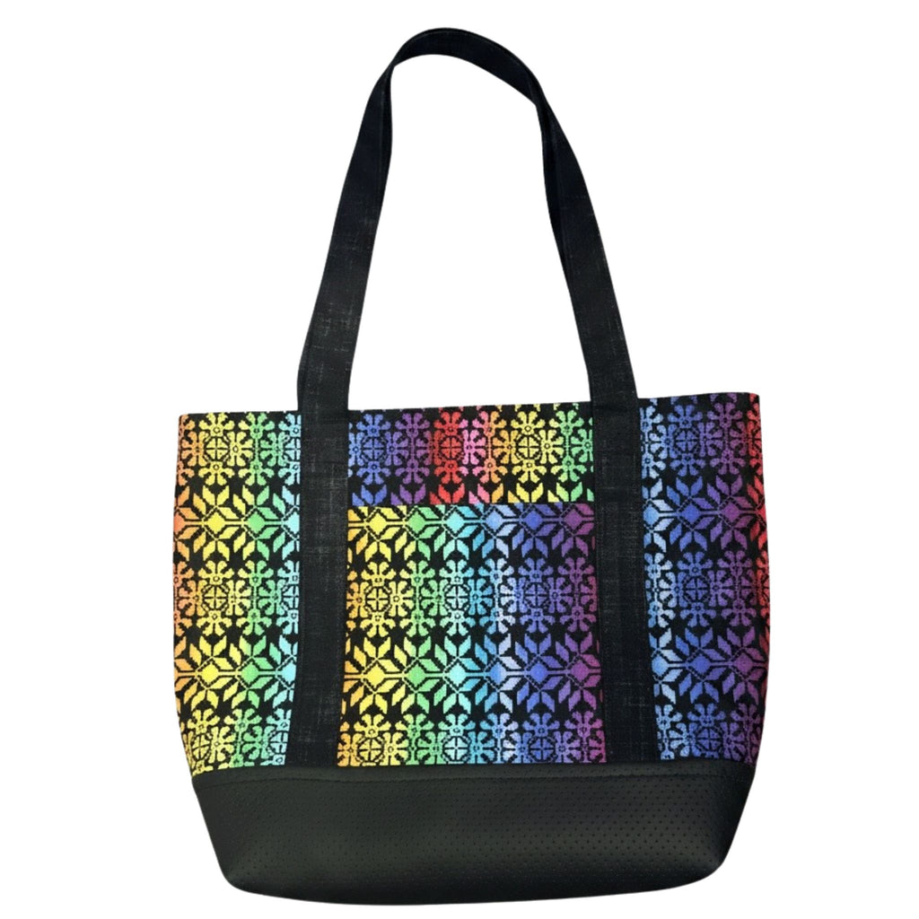 Handmade rainbow geometric cotton tote bag with black handles and black faux leather base