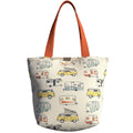 Oversized handmade canvas tote bag with retro camper print and burnt orange shoulder straps