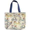 Oversized canvas tote bag with vintage bicycle print, floral baskets, striped background, and navy blue straps