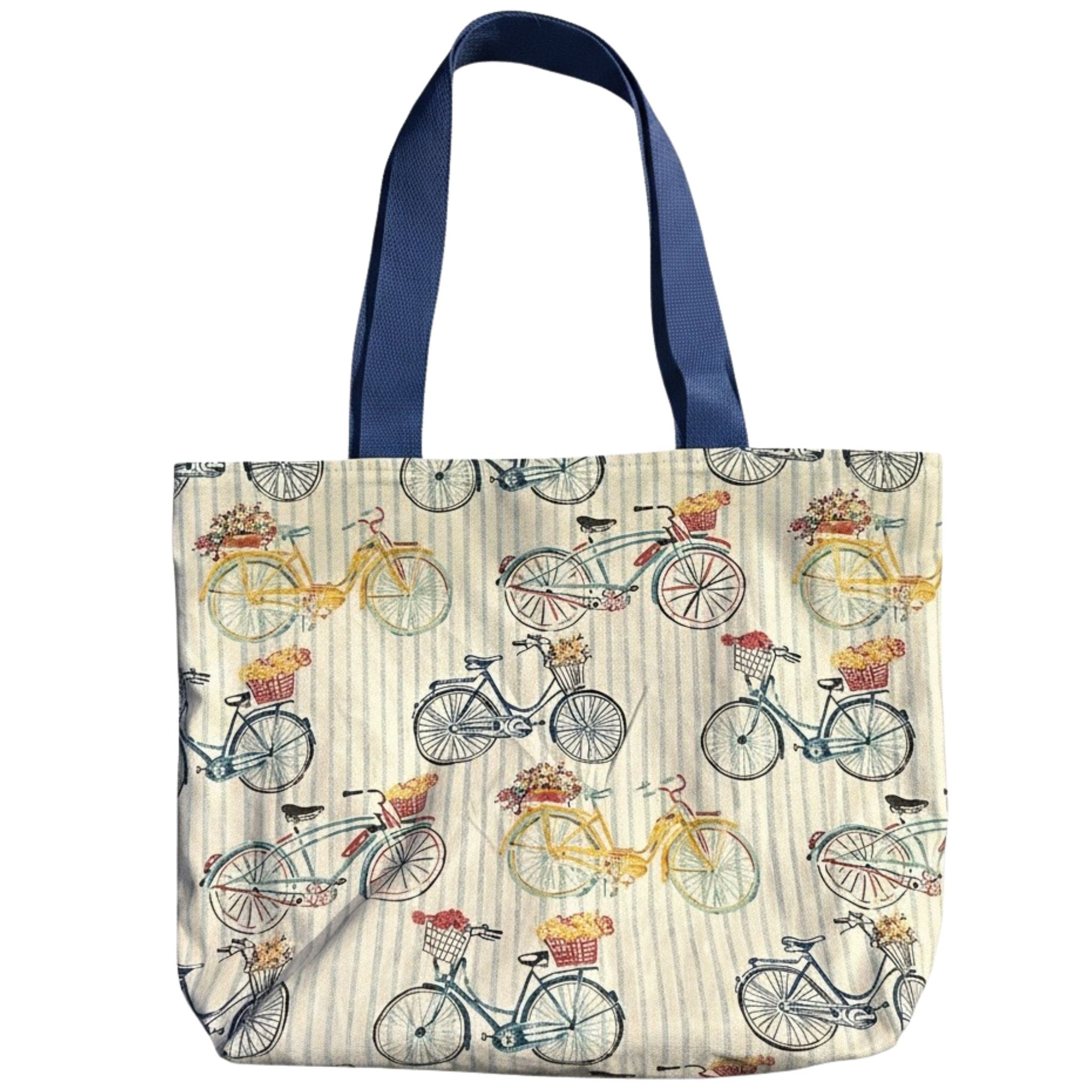 Oversized canvas tote bag with vintage bicycle print, floral baskets, striped background, and navy blue straps