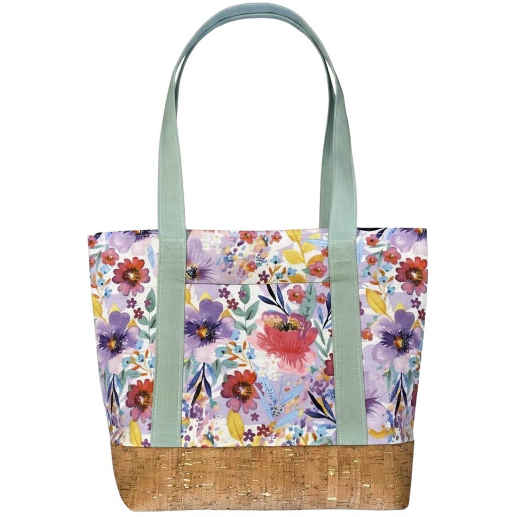 Handmade cotton tote bag featuring watercolor wildflowers with sage handles and natural cork base