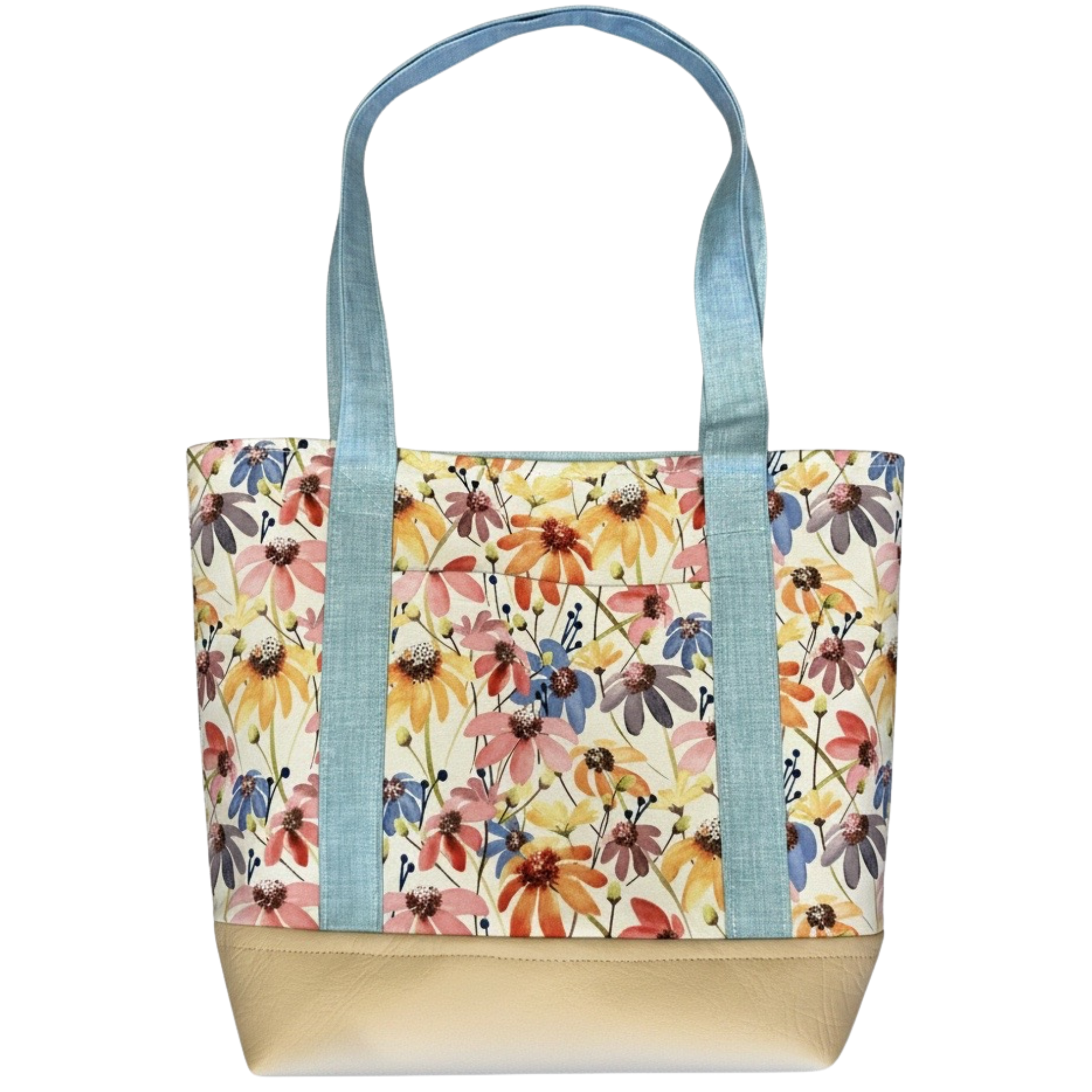 Handmade cotton tote bag featuring colorful wildflowers with sky blue handles and ivory faux leather base