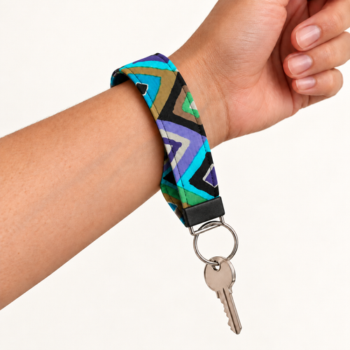 Angle Management – Fabric Wristlet Keychain worn around a wrist with a key attached