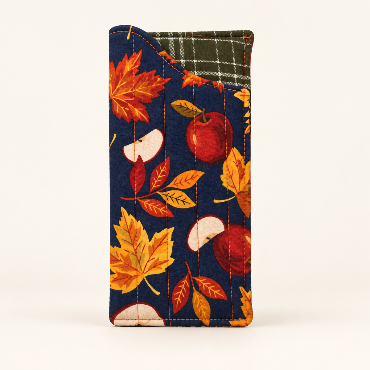 Apple of My Eye quilted glasses case with Olive Grid lining on off-white studio background