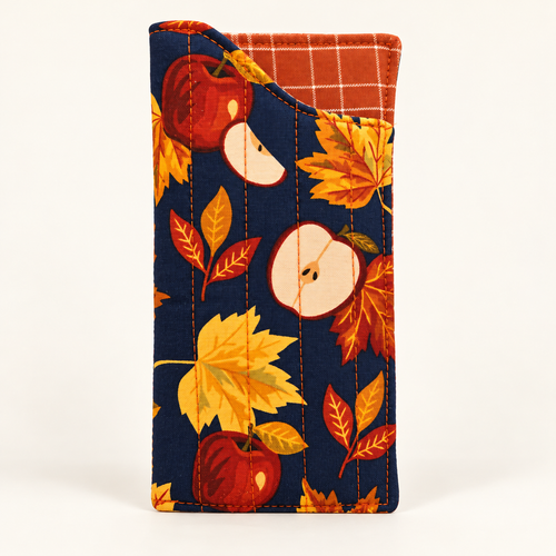 Apple of My Eye quilted glasses case with Rust Grid lining on off-white studio background
