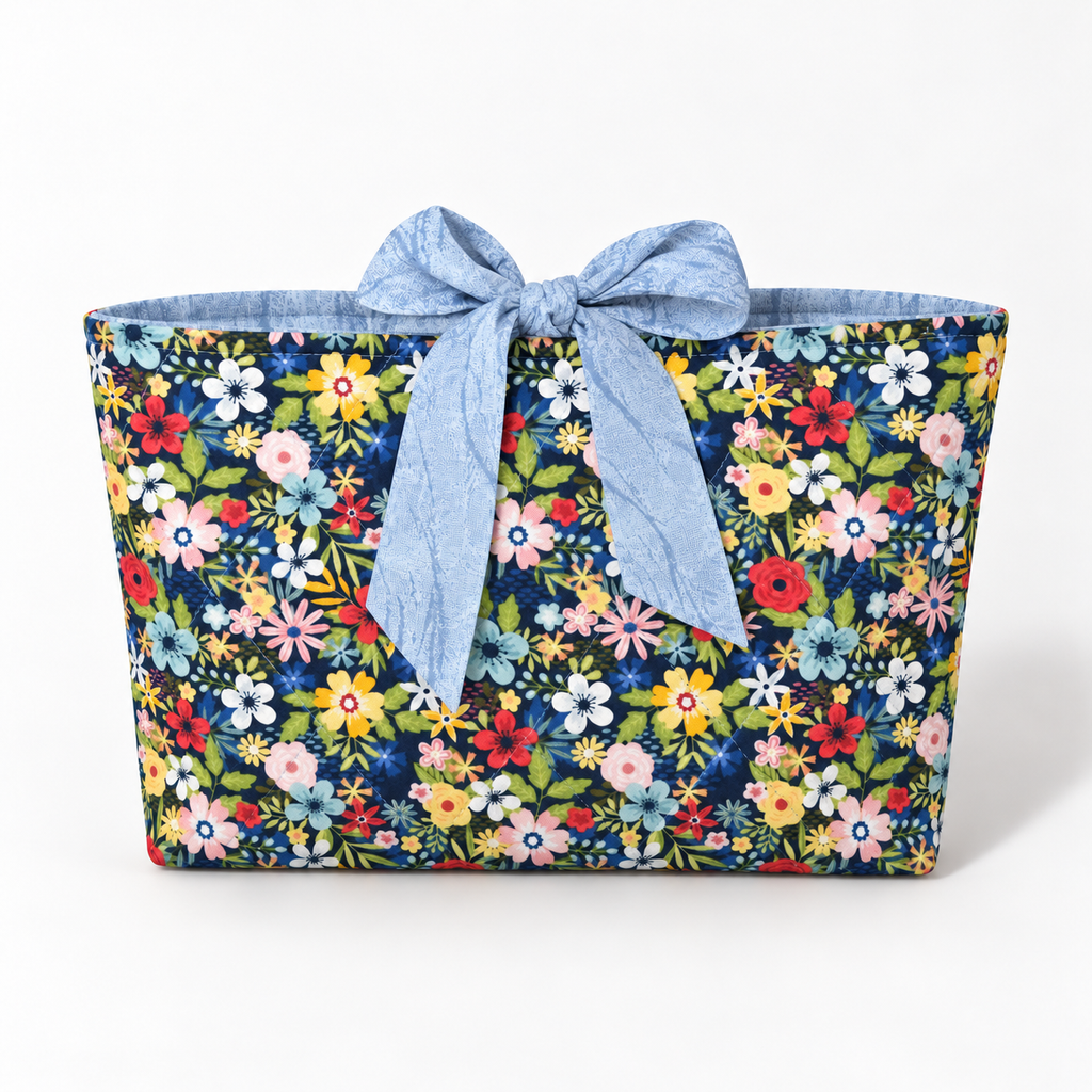 Bloom Between the Lines book sleeve with rounded pale blue patterned bow, front view