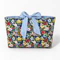 Bloom Between the Lines book sleeve with rounded pale blue patterned bow, front view