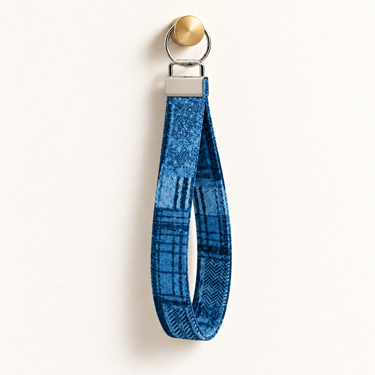 Check You Out – Fabric Wristlet Keychain hanging from a gold wall knob