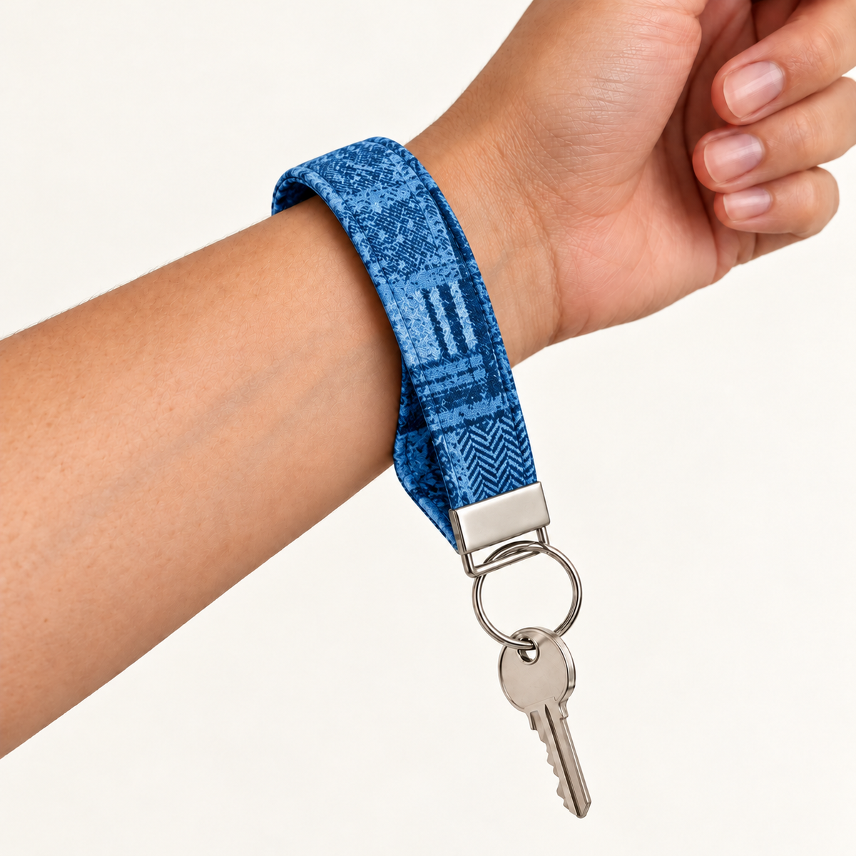 Check You Out – Fabric Wristlet Keychain worn around a wrist with a key attached