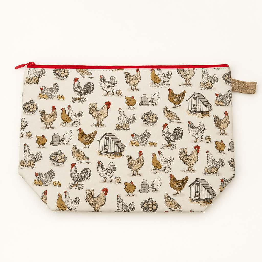 Cluck Around chicken print cotton zipper pouch laid flat with red zipper.