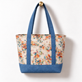 Soft Floral Cotton Tote Bag - Dusty Blue Denim Accent, hanging from a gold wall knob