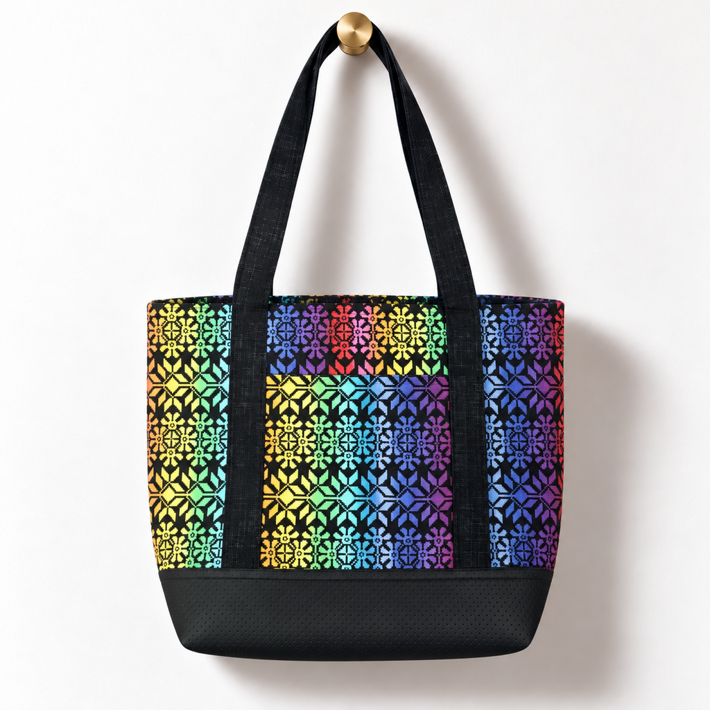 Rainbow Mosaic Cotton Tote Bag – Black, hanging from a gold wall knob