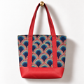 Rainbow Scallop Cotton Tote Bag – Red Dot, hanging from a gold wall knob