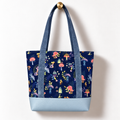 Enchanted Mushroom Cotton Tote Bag – Chambray & Powder Blue, hanging from a gold wall knob