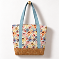 Wildflower Meadow Cotton Tote Bag – Sky Blue & Cork, hanging from a gold wall knob