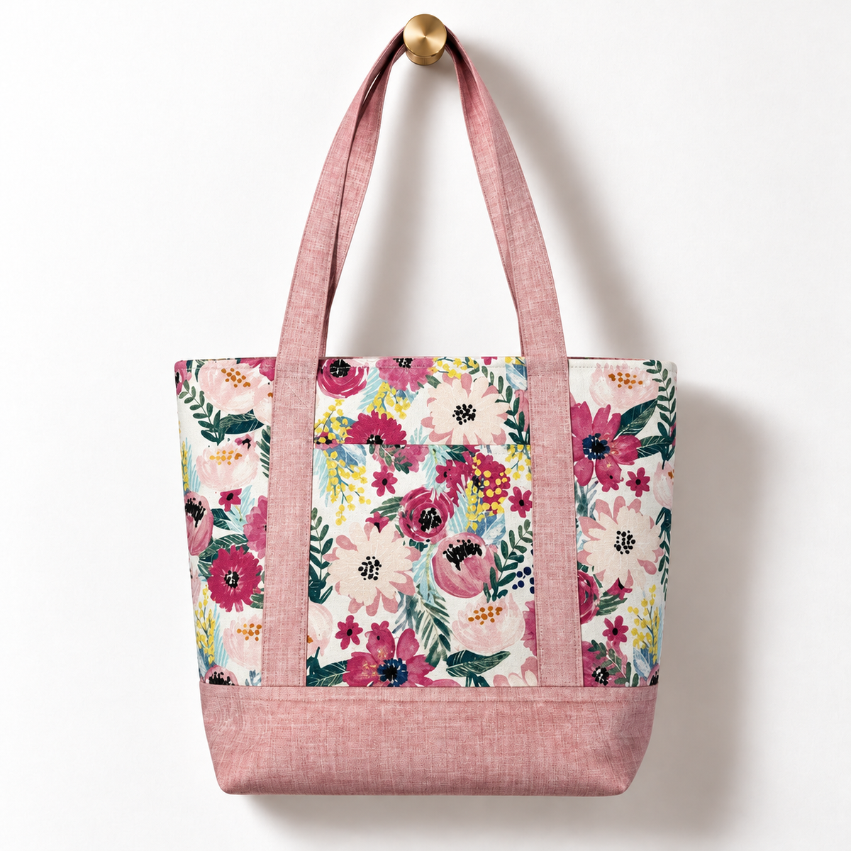 Blush Garden Floral Cotton Tote Bag – Blush Pink, hanging from a gold wall knob