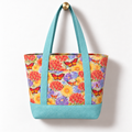 Wildflower Cotton Tote Bag - Dusty Blue, hanging from a gold wall knob
