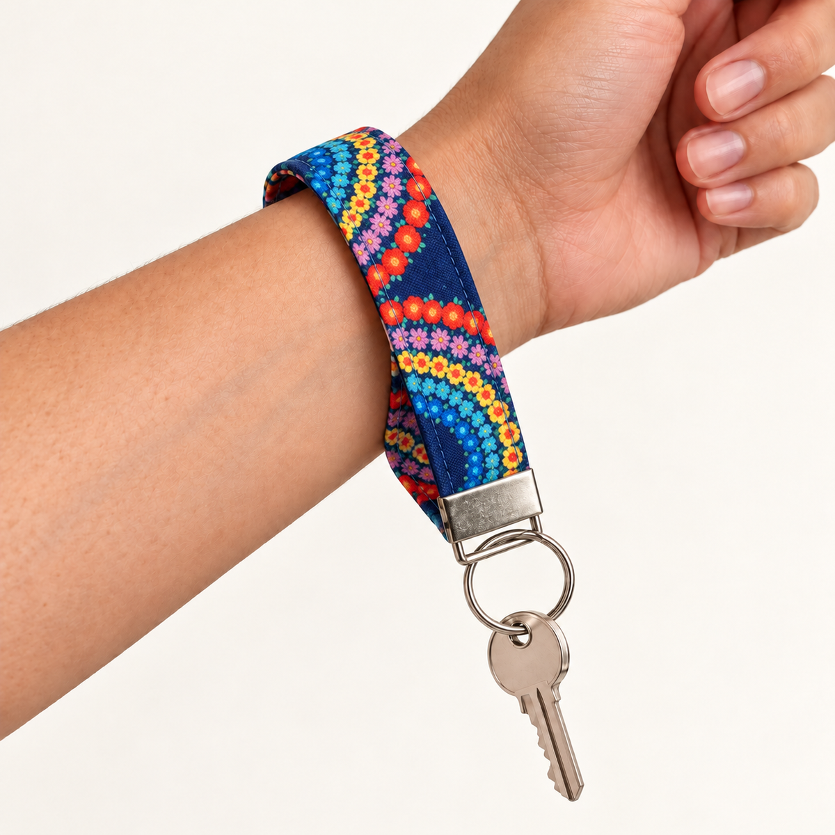 Full Circle – Fabric Wristlet Keychain worn around a wrist with a key attached