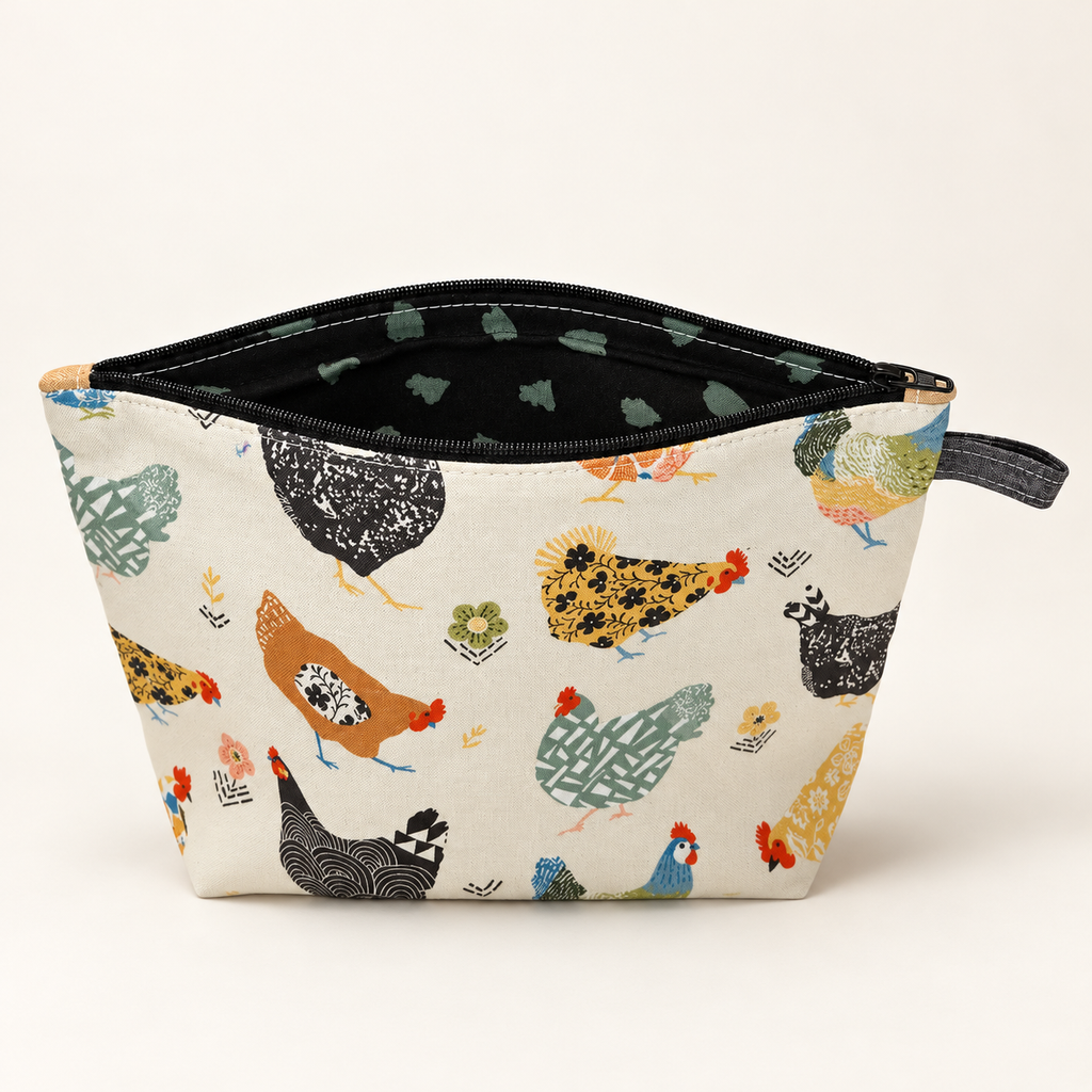 Hen Party chicken print cotton pouch with black zipper, standing view showing black and sage patterned lining