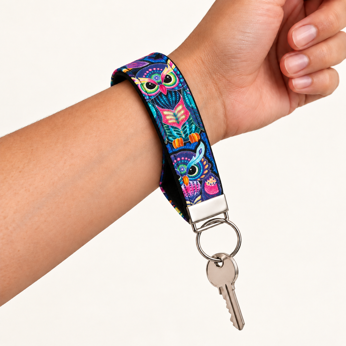 Owl Night Long – Fabric Wristlet Keychain worn around a wrist with a key attached