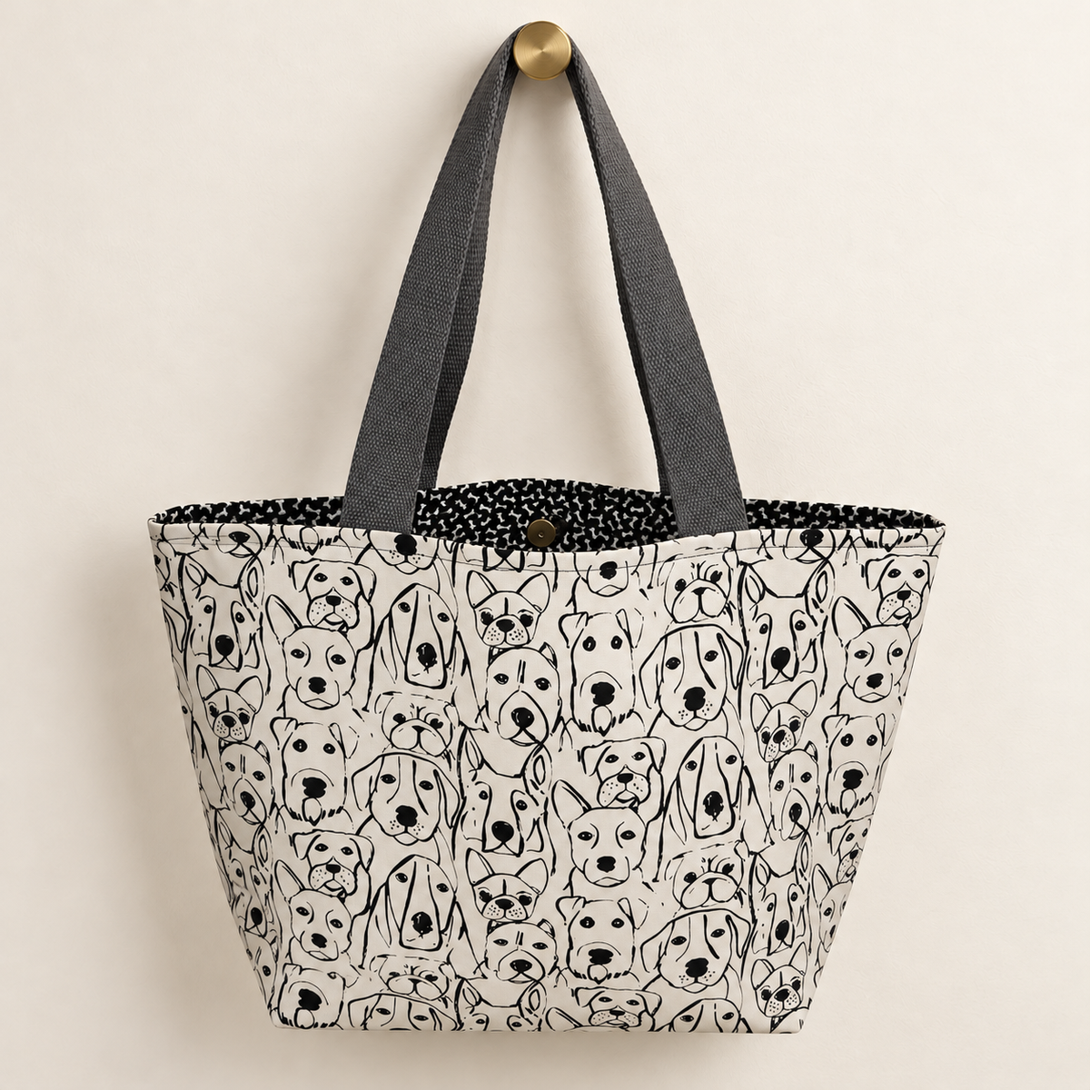 Pack Mentality Weekender Tote with dark gray handles and dog-bone print lining