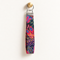 Pattern Behavior – Fabric Wristlet Keychain hanging from a gold wall knob