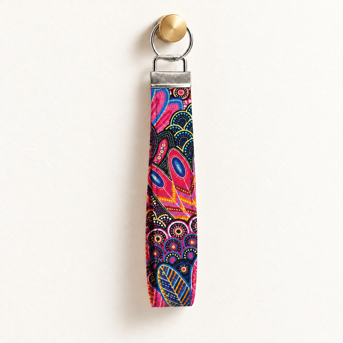 Pattern Behavior – Fabric Wristlet Keychain hanging from a gold wall knob