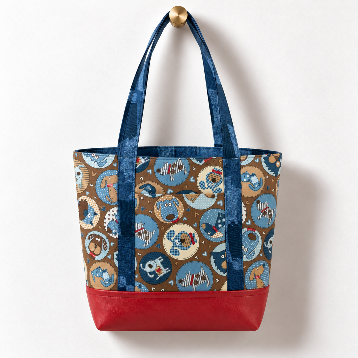 Retro Cartoon Dogs Cotton Tote Bag – Red & Blue hanging on a gold knob