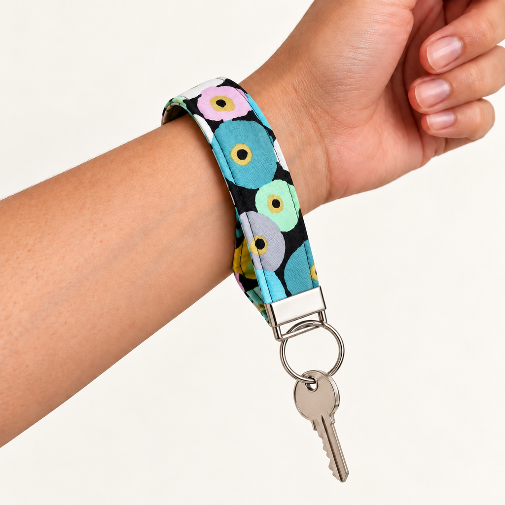 Petal Pop – Fabric Wristlet Keychain worn around a wrist with a key attached
