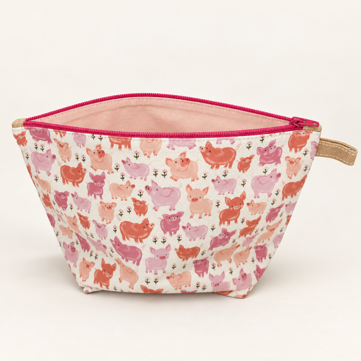 Pig Deal pink pig print cotton pouch with deep pink zipper, standing view showing pale blush lining