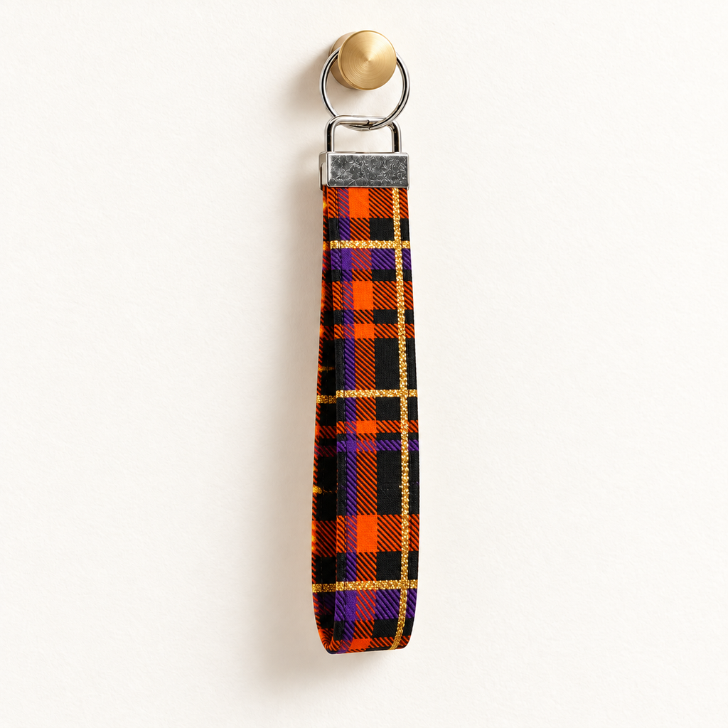 Plaid Behavior – Fabric Wristlet Keychain hanging from a gold wall knob