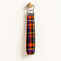 Plaid Behavior – Fabric Wristlet Keychain hanging from a gold wall knob