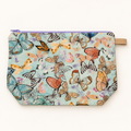 Social Butterfly pastel butterfly cotton pouch laid flat with lavender zipper.