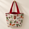 vintage vegetables and printed vegetable names on cream, red handles, red lining weekender tote hanging on a gold knob