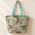 vintage butterfly dragonfly fern French postcard print, pale aqua handles, light green lining weekender tote hanging on a gold knob