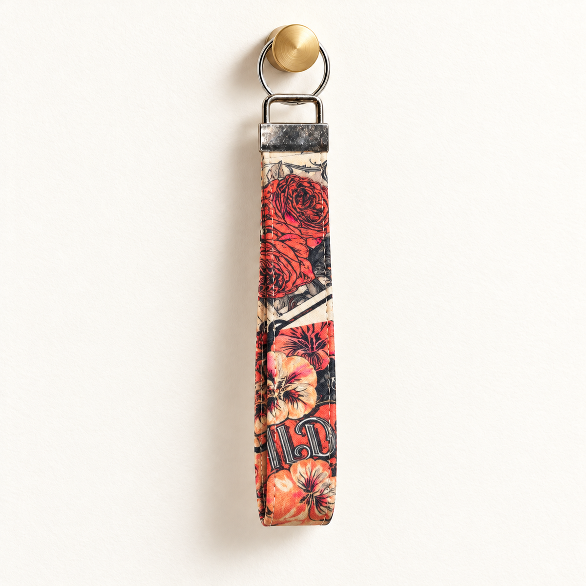 Wild at Heart – Fabric Wristlet Keychain hanging from a gold wall knob