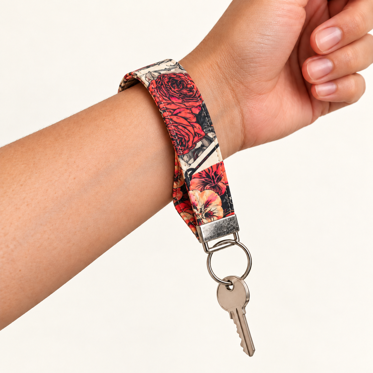 Wild at Heart – Fabric Wristlet Keychain worn around a wrist with a key attached