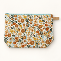 Wildflower Energy small floral cotton zipper pouch laid flat with pale aqua zipper.