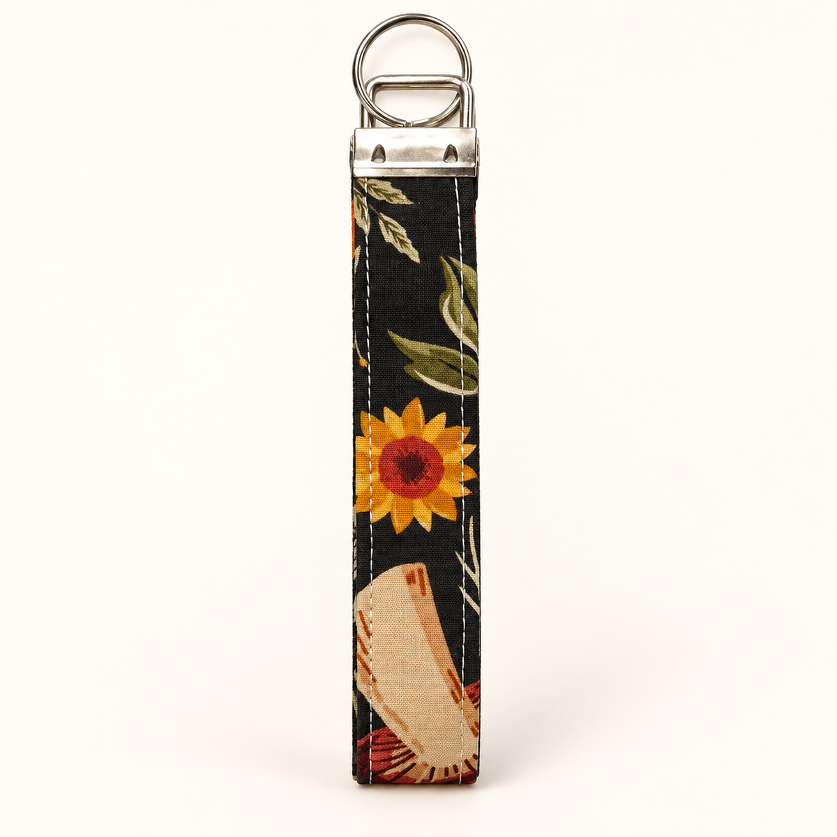 Bloom & Shroom wristlet showing sunflower print